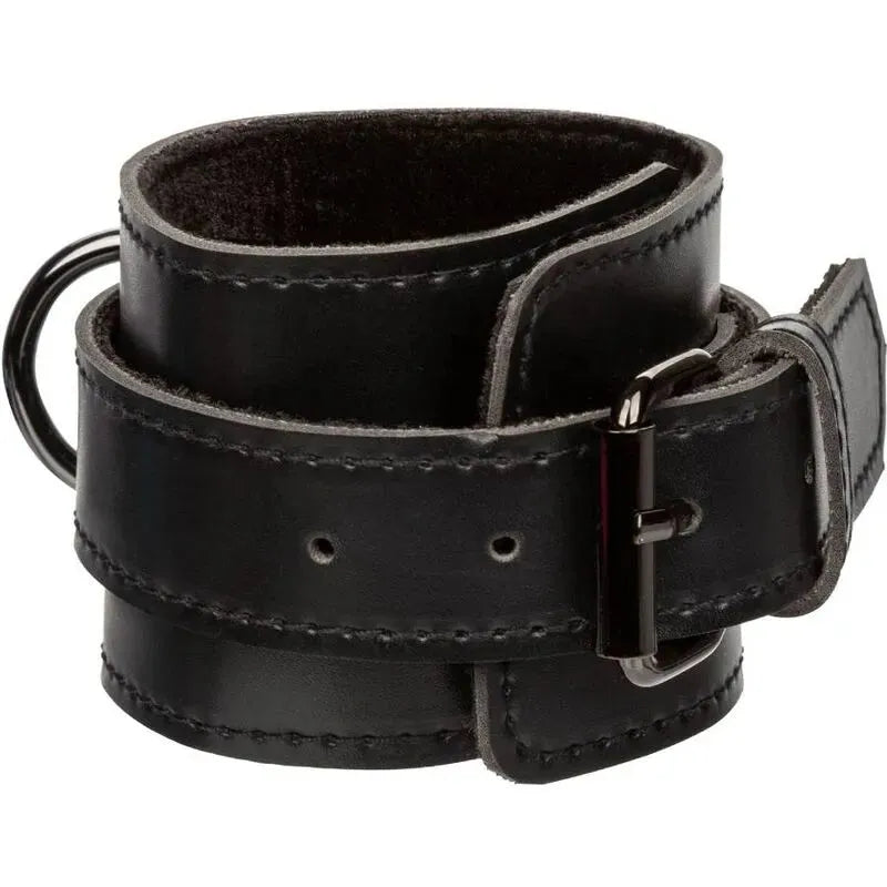 Menottes BDSM en cuir végétalien noir, intérieur velours doux, coutures renforcées, anneaux pivotants robustes.