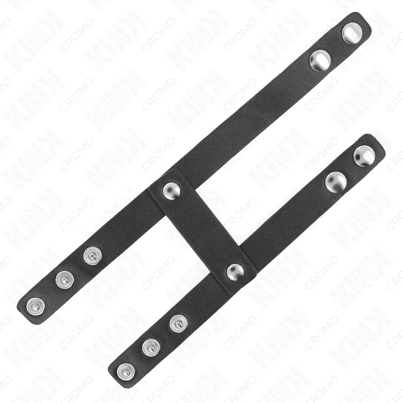 Anneau pénien réglable en cuir noir avec boutons-pression, design sophistiqué pour expérience BDSM intense et personnalisée.