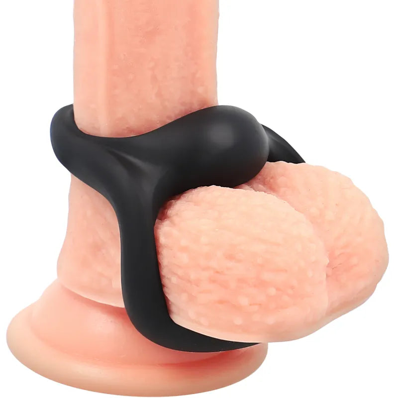 Anneau pénien noir en silicone hypoallergénique avec support scrotal intégré, extensible et doux pour confort optimal.