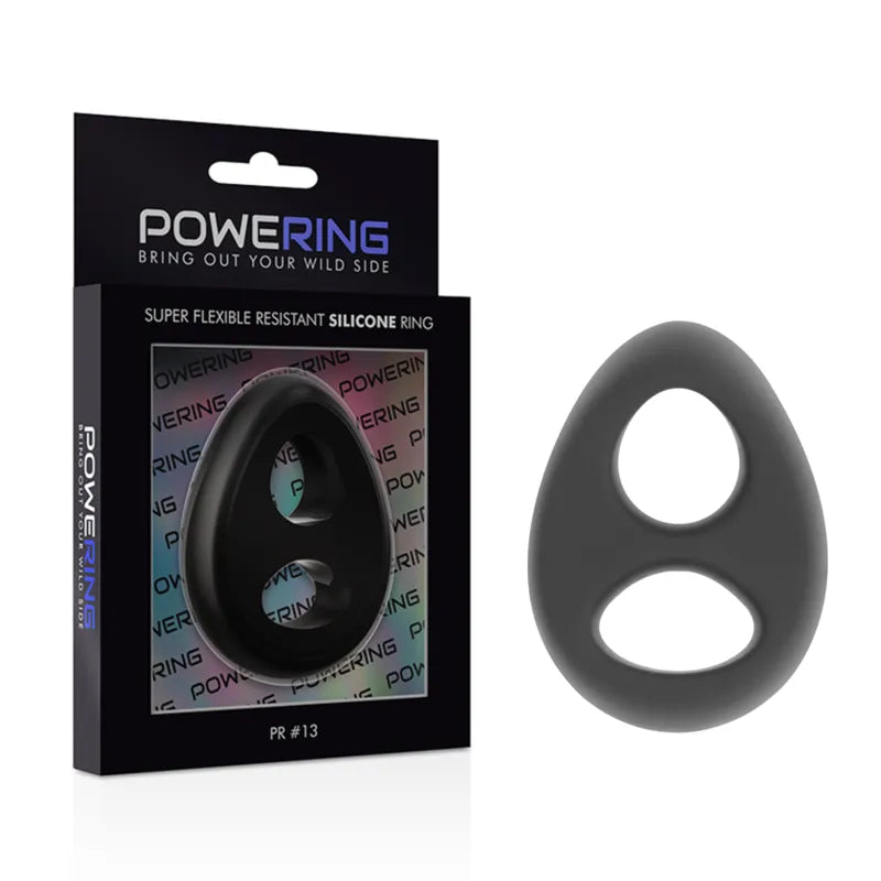 Anneau pénien silicone noir, extensible, hypoallergénique, avec maintien scrotum, dans emballage Powering.