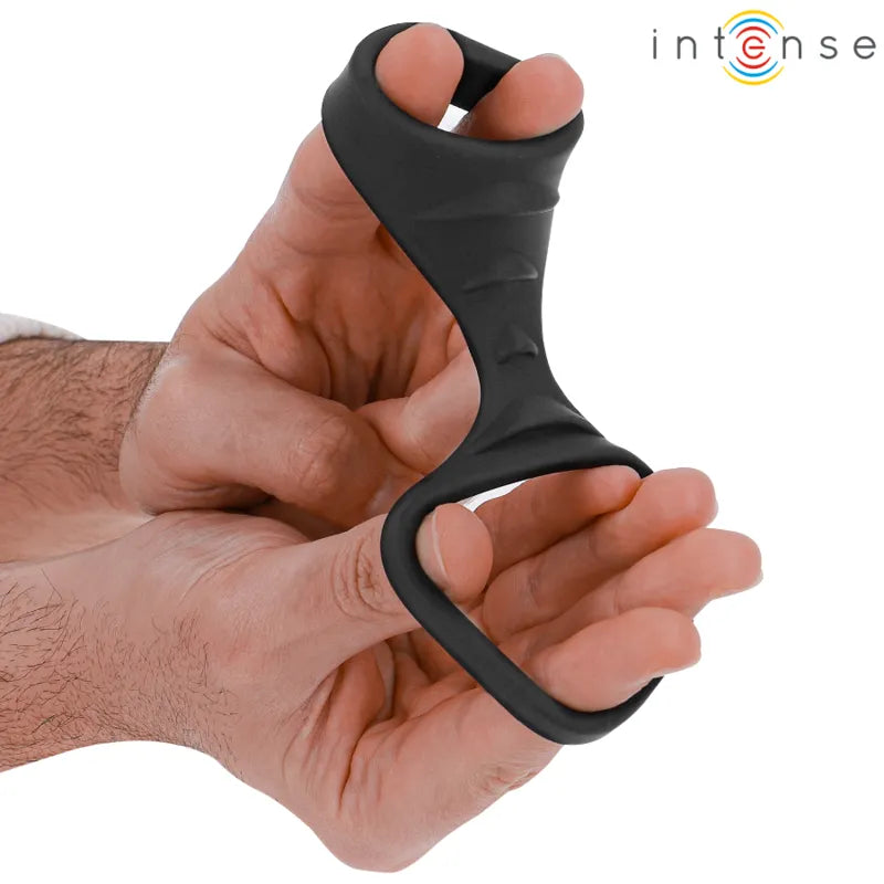 Anneau pénien silicone noir double ergonomique, design innovant, ajustable, pour prolongation érection et intensité.