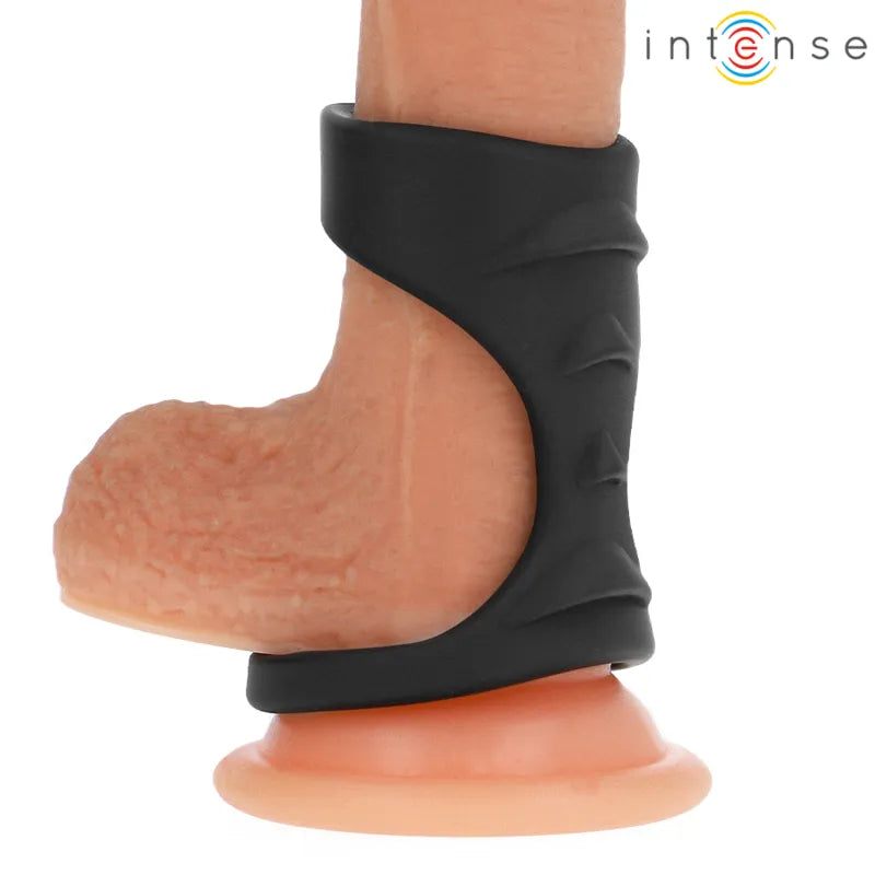 Anneau pénien noir en silicone, double anneaux ergonomiques, ajustable, sur fond blanc, pour prolongation érection.