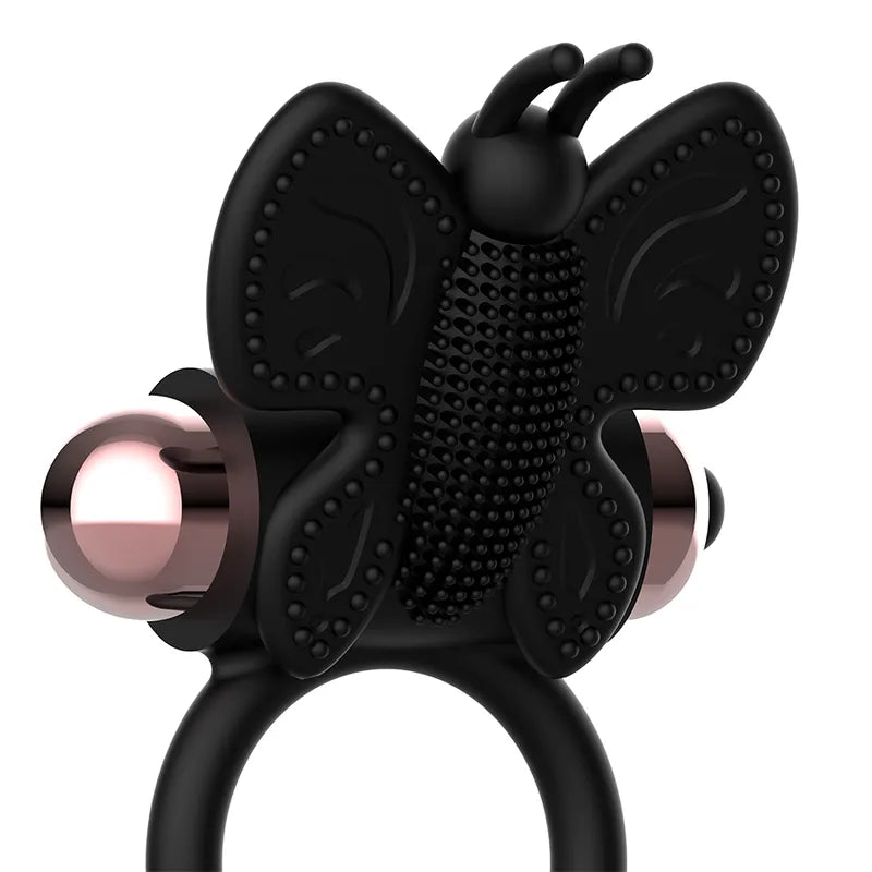 Anneau vibrant noir en silicone avec papillon texturé et accents métalliques, pour stimulation mutuelle et érection prolon...