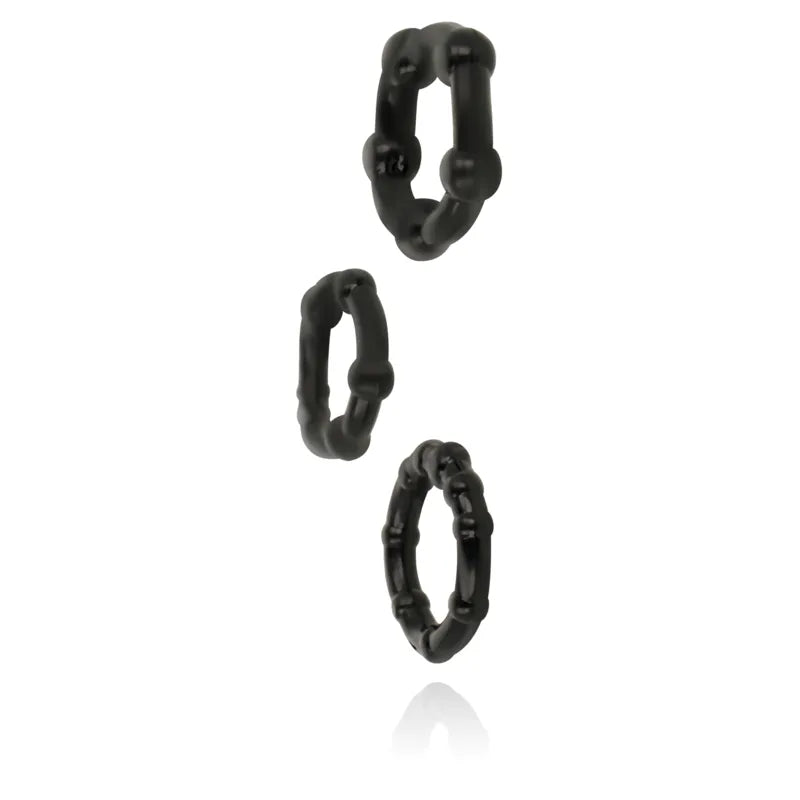 Anneaux silicone noirs ergonomiques pour érections prolongées, lot de trois, hypoallergéniques et sécurisés.