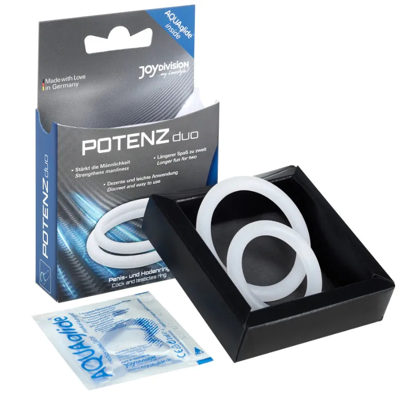 Anneaux pénis testicules silicone médical blanc, hypoallergénique, dans boîte noire avec emballage allemand visible.