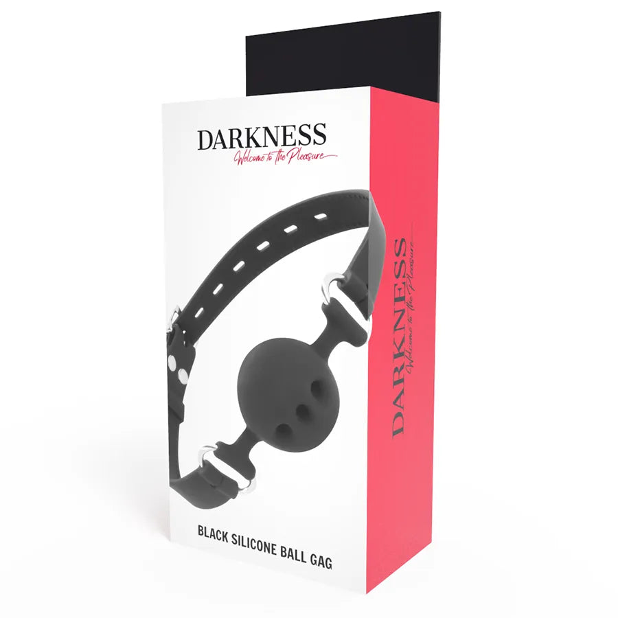 Bâillon BDSM en silicone noir avec lanières cuir ajustables, design élégant, sur fond blanc et rose, emballage visible.