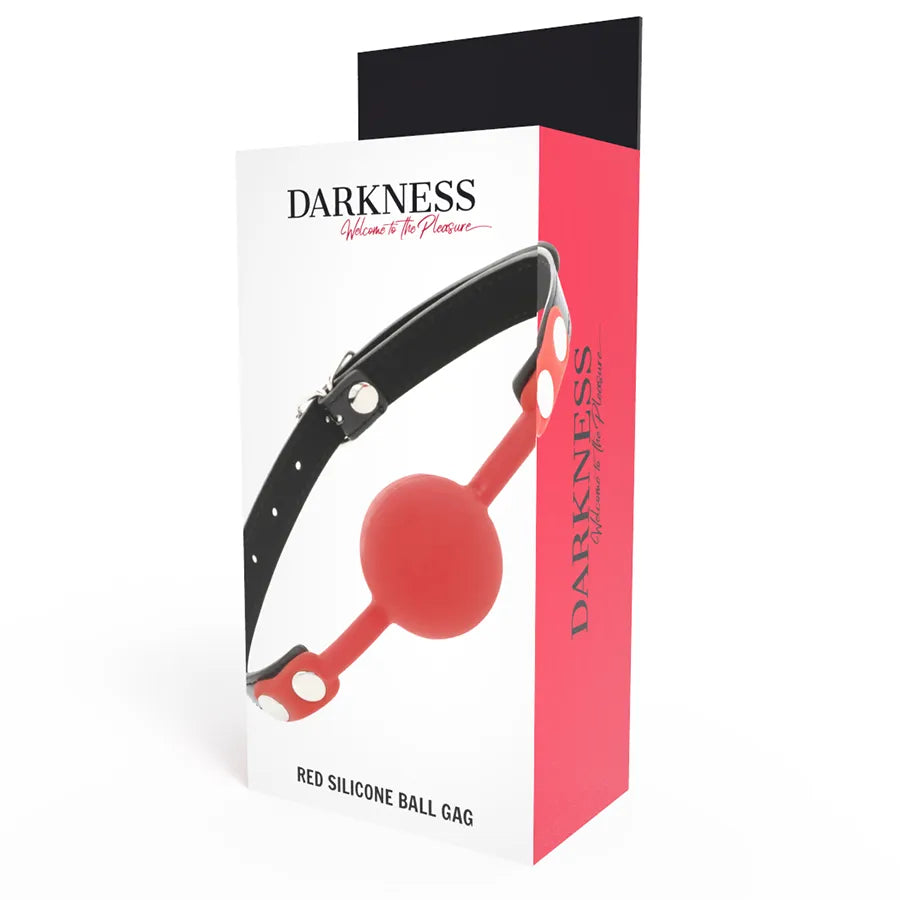 Bâillon BDSM en silicone rouge avec lanières en cuir noir, ajustable, sur fond blanc, emballage élégant.