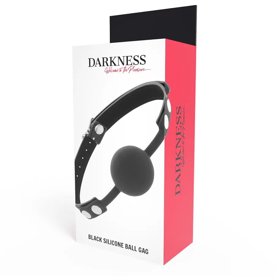 Bâillon silicone noir avec lanières cuir ajustables, sur fond blanc et rose, pour exploration BDSM sécurisée.