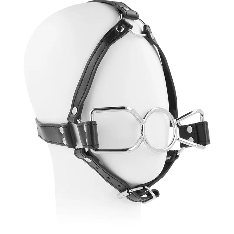Bâillon harnais BDSM en acier inoxydable, sangle noire ajustable, design robuste et confortable pour exploration fétichiste.