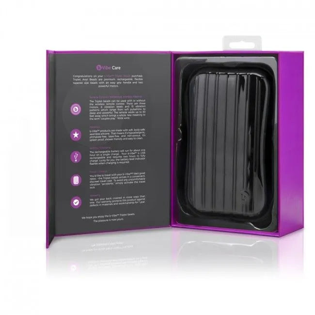 Bouchon anal B-Vibe Triplet noir en silicone avec télécommande, deux moteurs, dans un coffret violet ouvert.