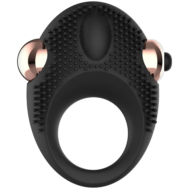 Bague vibrante noire en silicone, ergonomique, avec stimulateur clitoridien et embouts dorés, pour retard éjaculation.