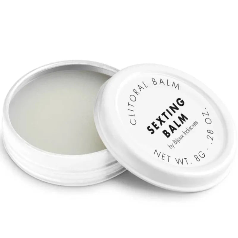 Baume clitoridien chauffant 8g, pot blanc ouvert, texture crémeuse, parfum envoûtant, stimulation intense, format portable.