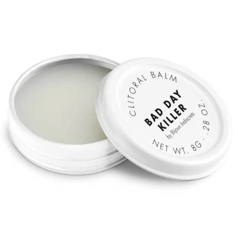 Baume clitoridien chauffant 8g, pot blanc compact ouvert, texture douce, parfumé, pour bien-être sensoriel intense.