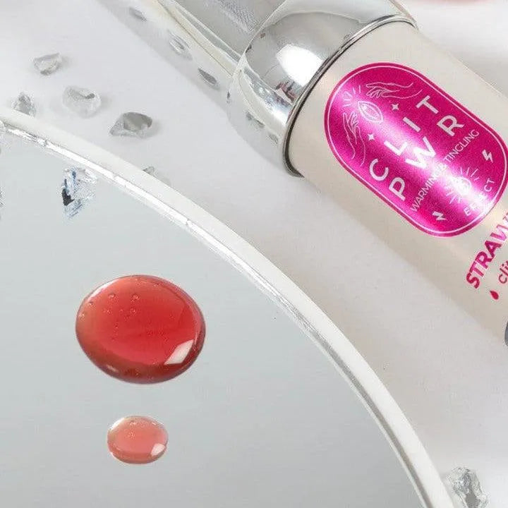 Baume stimulant clitoris fraise, tube 15ml, design discret, couleur rose, effet chauffant vibrant, ingrédients naturels.