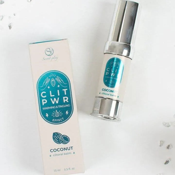 Baume clitoridien coco chauffant, flacon argenté 15ml, boîte blanche et bleue, intensifie sensations intimes.