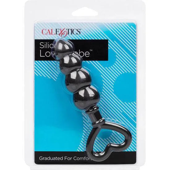 Bouchon anal silicone noir, forme graduée, boucle cœur, emballage bleu, ergonomique et hypoallergénique pour débutants.