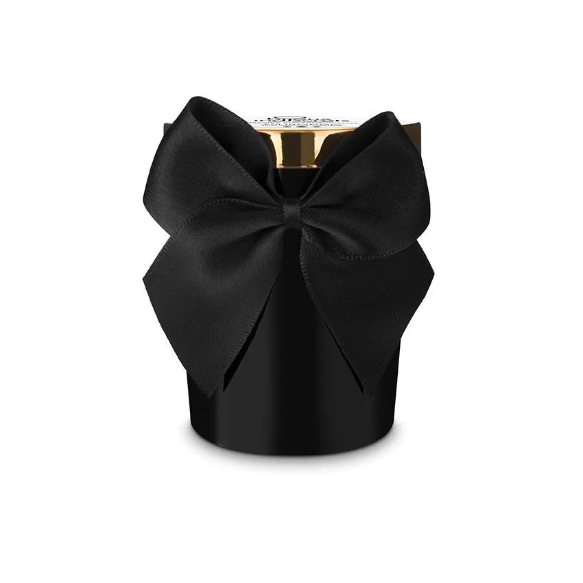 Bougie noire avec nœud noir, couvercle doré, parfum rose ylang-ylang jasmin épices, massage sensuel, luxe.