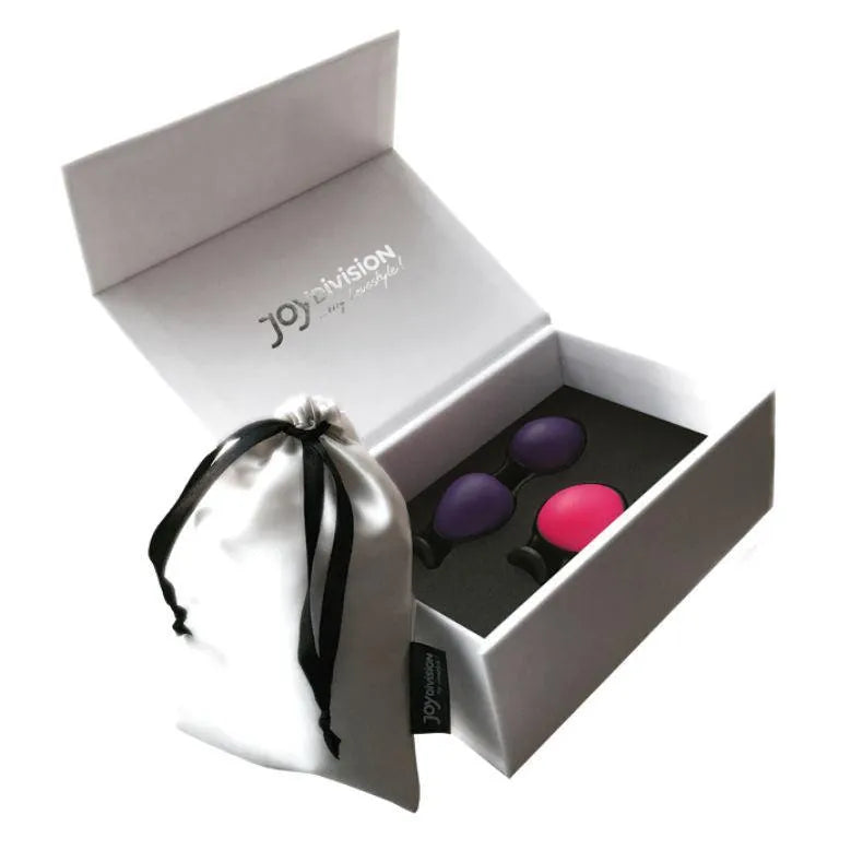 Coffret luxueux avec boules chinoises ergonomiques en silicone rose et violet pour entraînement pelvien discret.