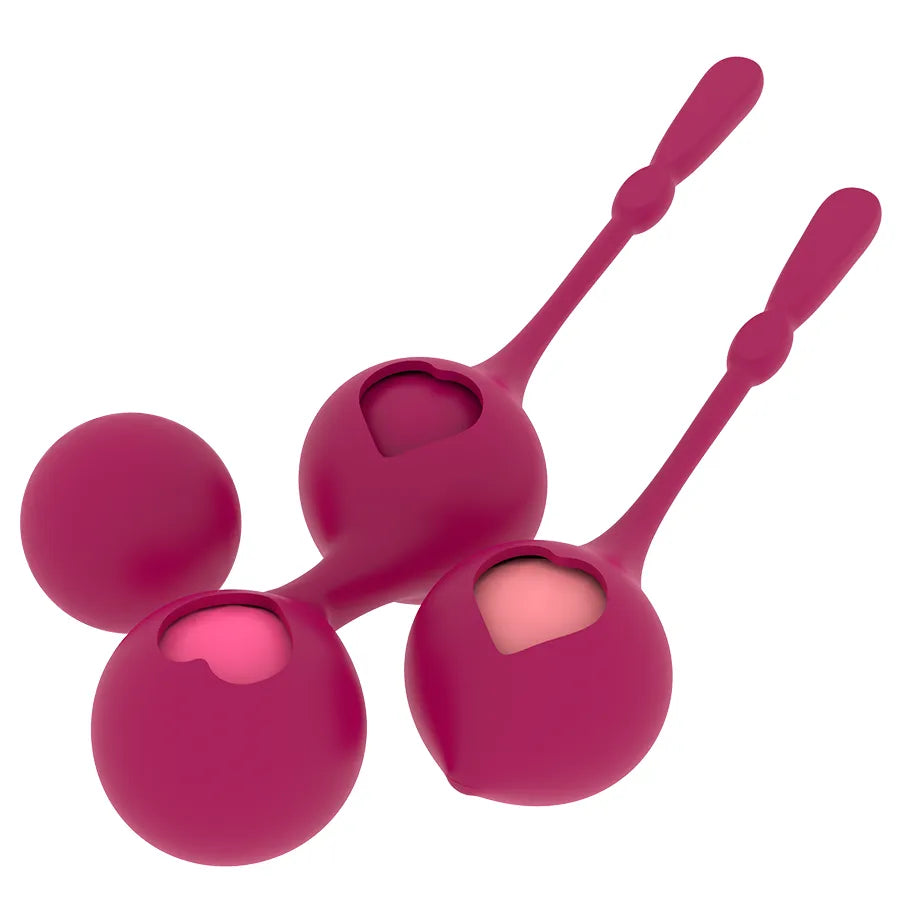 Boules de Geisha en silicone rose, quatre poids progressifs, design ergonomique pour renforcement pelvien.