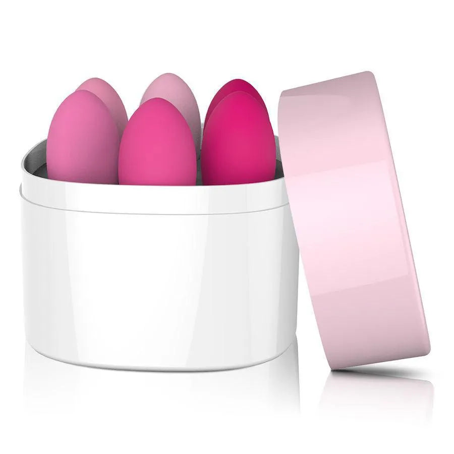 Boules de Geisha en silicone rose, différentes tailles, dans un étui blanc ouvert, pour renforcement pelvien.