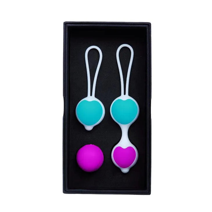 Boules de geisha en silicone bleu et rose, interchangeables, dans un coffret noir pour renforcement du plancher pelvien.