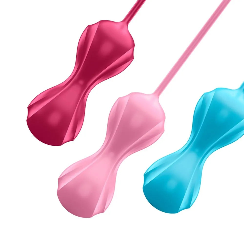 Boules de Geisha oscillantes en silicone rose, rouge et bleu, pour tonification périnéale, avec noyau oscillant.