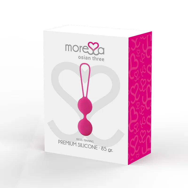 Boules Geisha roses en silicone hypoallergénique sur fond blanc, boîte avec motifs cœur, renforcement pelvien débutantes.