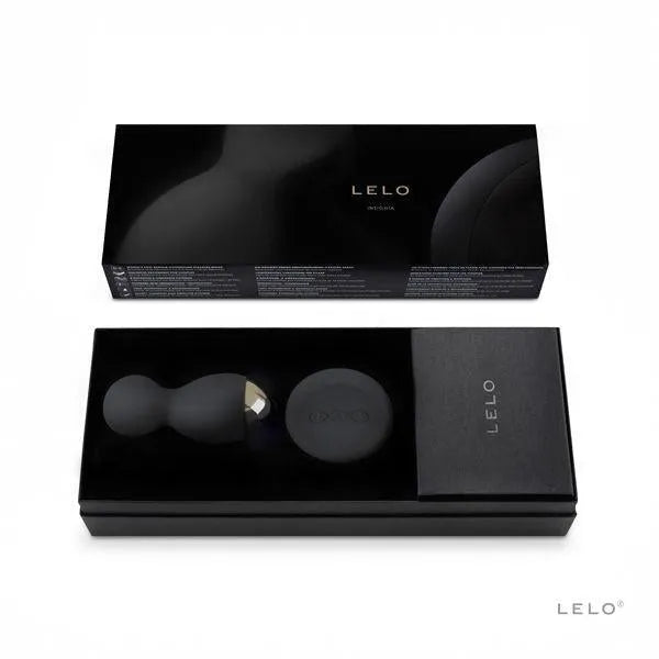 Boules plaisir rotatives noires en silicone avec télécommande, dans un coffret élégant, pour double stimulation et confort.