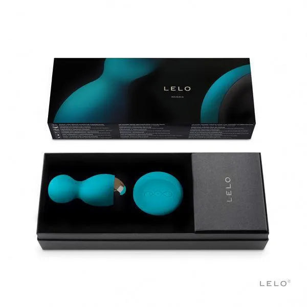 Boules plaisir rotatives vibrantes bleues avec télécommande, silicone biocompatible, dans boîte élégante noire.