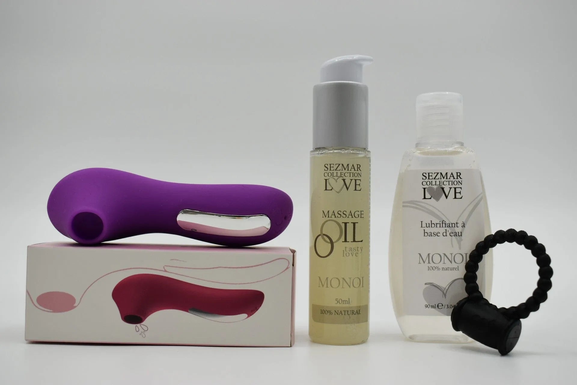 Coffret couple été: stimulateur violet, anneau noir, huile massage Monoï, lubrifiant, boîte design, édition limitée.