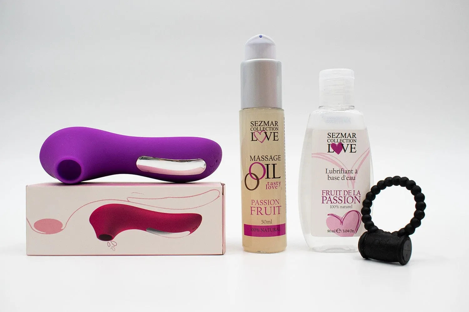 Coffret couple été avec stimulateur violet, anneau noir, huile massage fruit de la passion et lubrifiant 90ml.