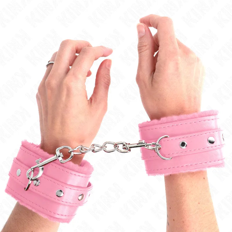 Bracelets BDSM roses en cuir véritable avec rembourrage doux, boucles métalliques robustes et chaîne de connexion.