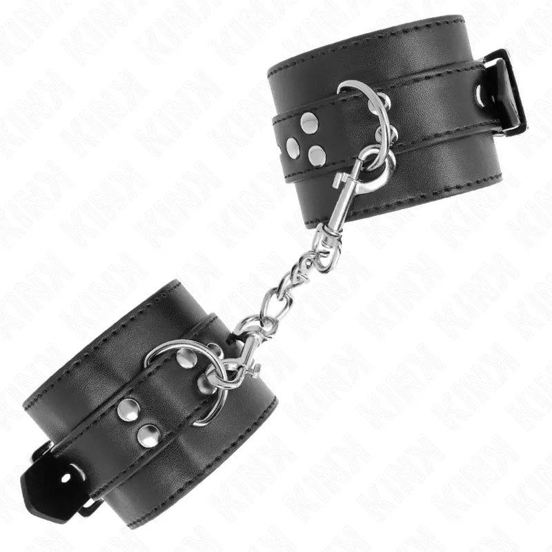 Bracelets BDSM en cuir noir avec rembourrage, boucles métalliques réglables et anneaux D, design élégant et sécurisé.