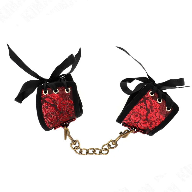 Bracelets BDSM en cuir noir et rouge, boucles robustes, chaîne dorée, design élégant et ergonomique pour sessions sécurisées.