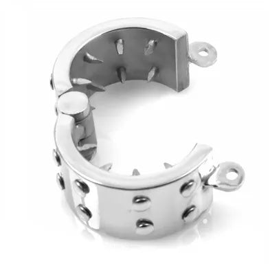 Anneau pénien en acier inoxydable poli, design ergonomique, finition lisse, robuste et hygiénique avec cadenas.