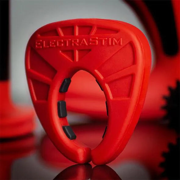 Anneau silicone rouge et noir, forme ovale, électrostimulation, ergonomique, antidérapant, pour usage intime.
