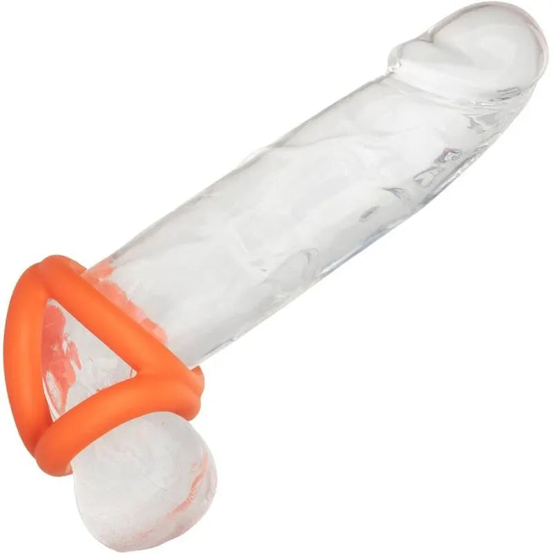 Anneau pénien triple en silicone liquide orange, ergonomique et extensible, sur modèle transparent.