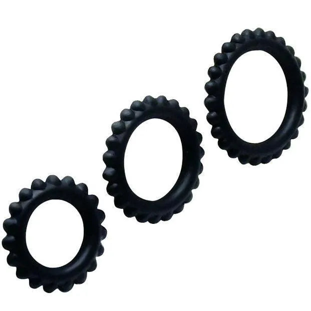 Anneaux péniens silicone noirs, texturés, trois tailles, flexibles, submersibles, pour prolongation plaisir et confort.