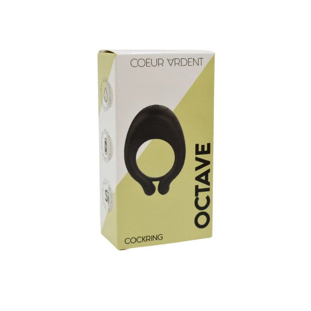 Anneau vibrant noir en silicone doux, double anneaux, sur emballage jaune et blanc, sans phtalates, étanche.