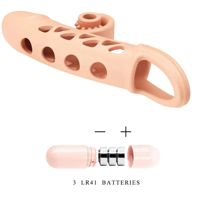 Anneau vibrant silicone naturel beige, ergonomique, trous ovales, avec stimulateur amovible et piles LR41 incluses.