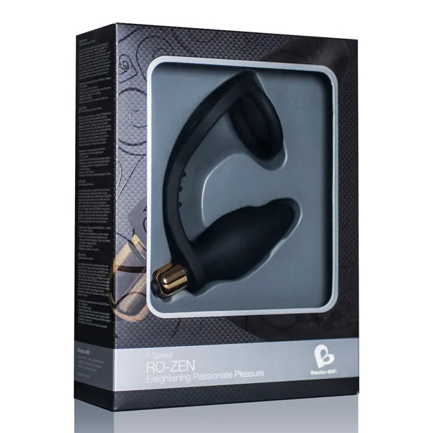 Anneau pénien vibrant noir en silicone médical, forme ergonomique, balle amovible, dans un emballage élégant.