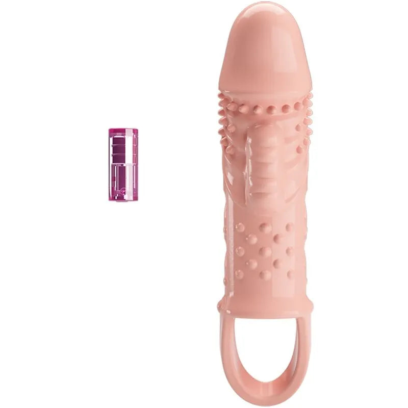 Anneau pénien vibrant rose en TPR souple avec texture stimulante et module de vibration violet, ergonomique et discret.