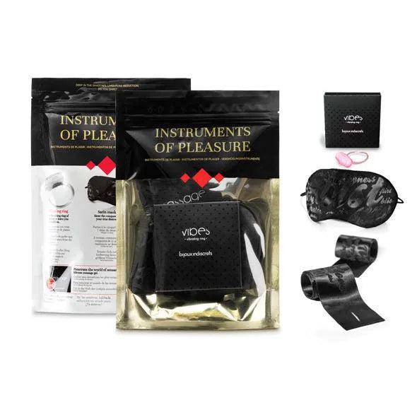 Anneau vibrant noir ergonomique en silicone avec masque et menottes satinés, emballage élégant, pour plaisir intense.