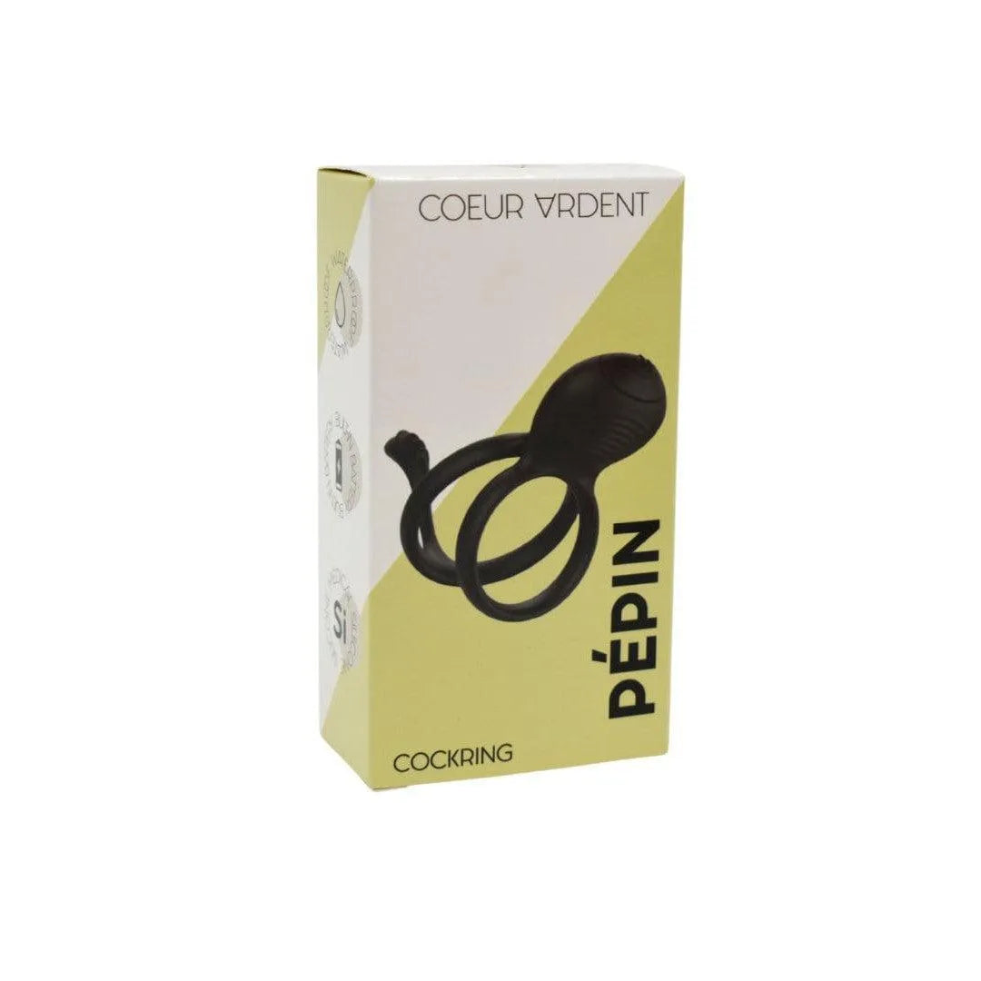 Anneau pénien vibrant noir en silicone doux avec double anneau, présenté dans une boîte jaune et blanche.