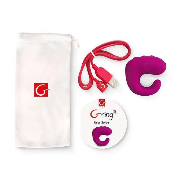 Anneau vibrant silicone violet ergonomique avec câble rouge, guide utilisateur et pochette blanche, 6 fonctions vibration.