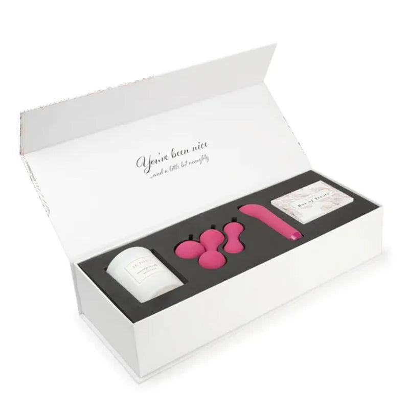 Coffret Je Joue édition limitée, motif plume or rose, vibromasseur rose, boules Kegel, boîte blanche ouverte.
