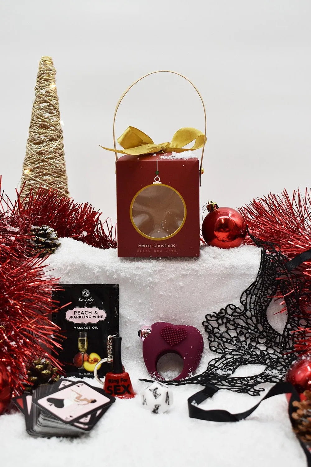 coffret coquin édition limitée noël sensuel festif huile massage pêche vin pétillant anneau vibrant pénien cœur masque brodé dé cartes