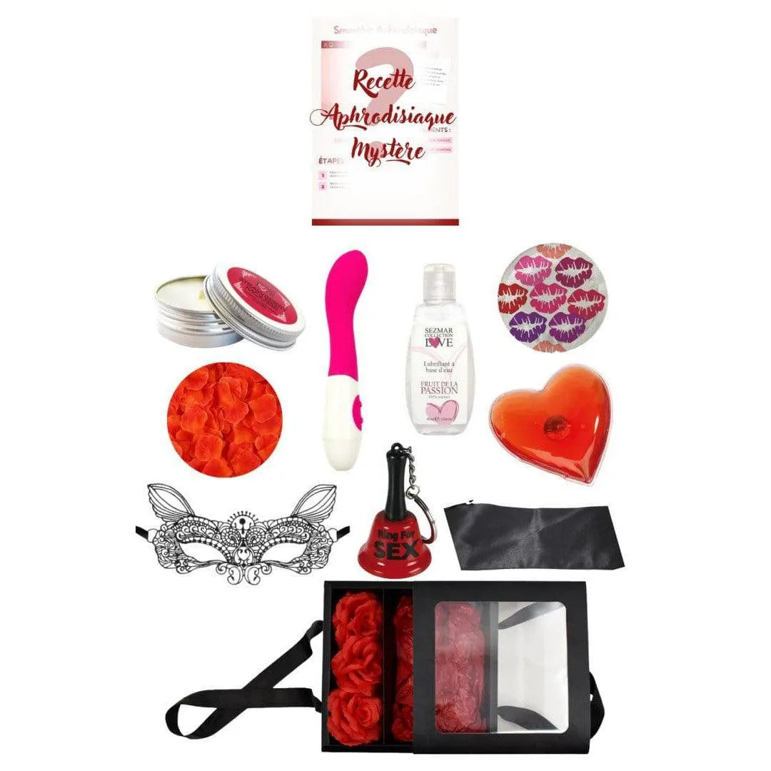 Coffret coquin édition limitée avec accessoires érotiques, masque dentelle, huile massage, jouet rose, pétales rouges.