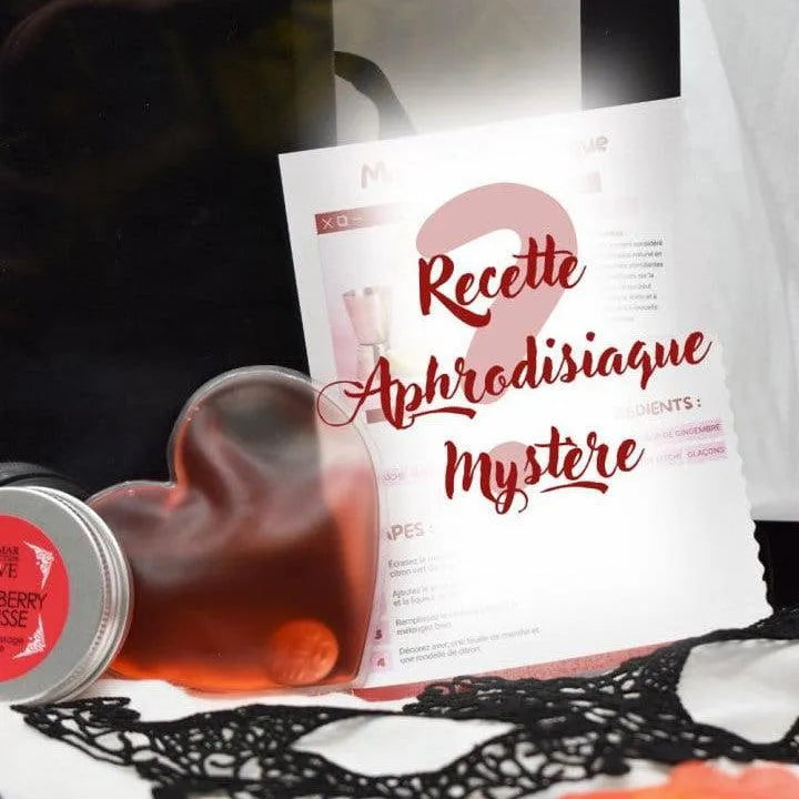 Coffret romantique avec bougie, huile de massage, bandeau satiné, masque dentelle, pétales de soie, ambiance sensuelle.