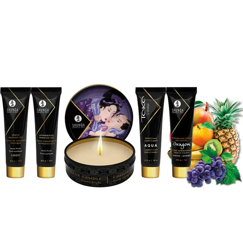 Coffret Shunga érotique avec huile chauffante, bougie, lubrifiant, design élégant, fruits exotiques en arrière-plan.